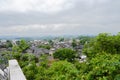 Overlook to ancient town from hillside parapet in cloudy spring