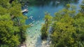 Overlooking boardwalks with deck jumping, swimming, kayaking, paddling, floating to turquoise blue water of Morrison Springs