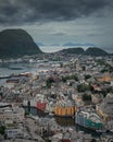 Overlooking the coastline of city Alesund with colorful houses and mountains in Norway Royalty Free Stock Photo
