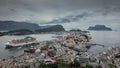 Overlooking the coastline of city Alesund with colorful houses and mountains in Norway Royalty Free Stock Photo