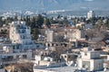 Overlooking the dense Nicosia cityscape with buildings and mountains in the background