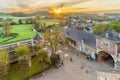 Jeker valley during a spectacular autumn sunrise with amazing sun beams overlooking Chateau Neercanne