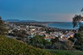 Overlooking town nestled against ocean shore. Royalty Free Stock Photo