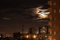 Overnight in the city with the cloudy sky and the moon as the protagonist.