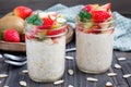 Overnight oatmeal with fresh strawberry and kiwi, garnished with sliced almond Royalty Free Stock Photo