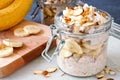 Overnight oats with bananas and nuts in glass canning jars