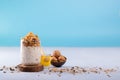 Overnight oats with walnuts, accompanied with honey and whole walnuts Royalty Free Stock Photo