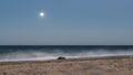 Overnight on the Red Sea beach. The full moon is shining in the blue sky. Royalty Free Stock Photo