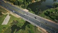 An overpass across the city river. Busy freeway. Aerial photography