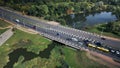 An overpass across the city river. Busy freeway. Aerial photography