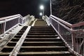 Overpass staircase at night covered in snow. Winter. Russia