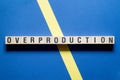 Overproduction word concept on cubes Royalty Free Stock Photo
