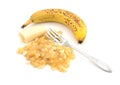 Overripe banana with a fork and pureed fruit