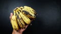 Overripe bananas almost rot and dry.  on black background Royalty Free Stock Photo