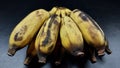 Overripe bananas almost rot and dry. Isolated on black background Royalty Free Stock Photo