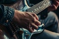 overshoulder view of guitarist, focusing on fretting hand Royalty Free Stock Photo