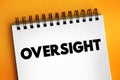 Oversight - an unintentional failure to notice or do something, text concept on notepad