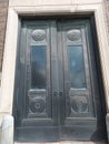 Oversized black iron doors on a building entrance Royalty Free Stock Photo