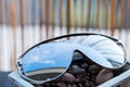 Oversized sunglasses model with big lenses and metal framereflecting the sun closeup.Selective focus Royalty Free Stock Photo