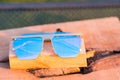 Oversized sunglasses model with blue lenses closeup . Selective focus