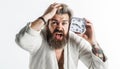 Overslept bearded man with alarm clock. Oversleeping, late for work, bad morning, tardiness concept. Royalty Free Stock Photo