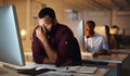 Overtime is starting to kill me now. a young businessman looking stressed out while working late in an office. Royalty Free Stock Photo