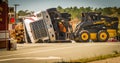 Carrboro NC, /US-March 10 2017:Bobcat working on logging truck