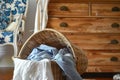 overturned basket of laundry by the dresser