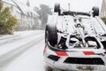 Overturned Car After Traffic Accident In Winter Snow Royalty Free Stock Photo
