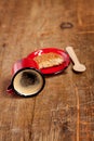 Overturned espresso coffee in red enamel mug Royalty Free Stock Photo