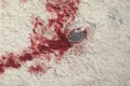 Overturned glass and spilled red wine on white carpet, top view Royalty Free Stock Photo