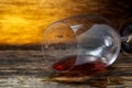 Overturned glass of wine on floor Royalty Free Stock Photo