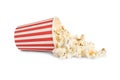 Overturned paper cup with delicious popcorn isolated