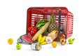 Overturned shopping basket full of variety of grocery products, food and drink isolated on white background Royalty Free Stock Photo