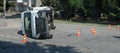 Overturned transport on accident site with traffic cones