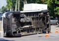 Overturned transport on accident site with traffic cones