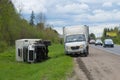 Overturned truck GAZ-3309 lies on the side of the road