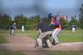 Overview amateur baseball game from behind the backstop