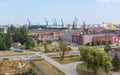 Overview of the city Gdansk and the heavy cranes of the Shipyard.