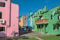 Overview of colorful terraced houses, balcony and clothes hanging in an alley in Burano. Royalty Free Stock Photo