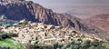 Overview of the Dana village on the edge of the Dana Nature Reserve in Jordan, with the Wadi Araba and the desert of Israel in the Royalty Free Stock Photo