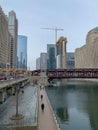 Overview of frozen Chicago River, upper Wacker Drive, and el train crossing Wells Street