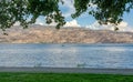 Overview of Okanagan lake with a boat and waterskiing man on the water