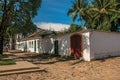 Overview of old colored houses, palm tree and cobblestone in Paraty.