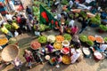 Overview of the street scene at a local vegetable market in Dhaka, Bangladesh showing colorfull fruits and spices