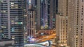 Overview to JBR and Dubai Marina skyline with modern high rise skyscrapers waterfront living apartments aerial all night Royalty Free Stock Photo