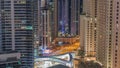 Overview to JBR and Dubai Marina skyline with modern high rise skyscrapers waterfront living apartments aerial all night Royalty Free Stock Photo