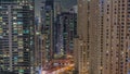 Overview to JBR and Dubai Marina skyline with modern high rise skyscrapers waterfront living apartments aerial night Royalty Free Stock Photo