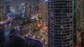 Overview to JBR and Dubai Marina skyline with modern high rise skyscrapers waterfront living apartments aerial night Royalty Free Stock Photo