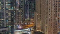 Overview to JBR and Dubai Marina skyline with modern high rise skyscrapers waterfront living apartments aerial night Royalty Free Stock Photo